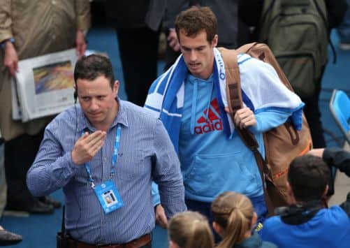 Andy Murray walks off as rain stops his match with Nicolas Mahut at Queens. Picture: Clive Brunskill/Getty