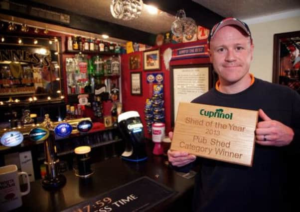 Garry Logan, from Ayr, with his Pub Shed award. Picture: PA