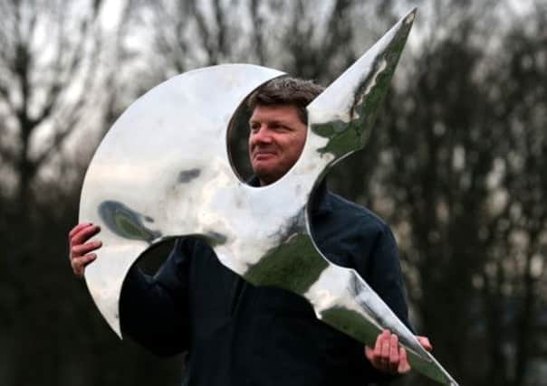 David Anderson, monuments architect for the Bannockburn Project, with the new wind vane. Picture: PA