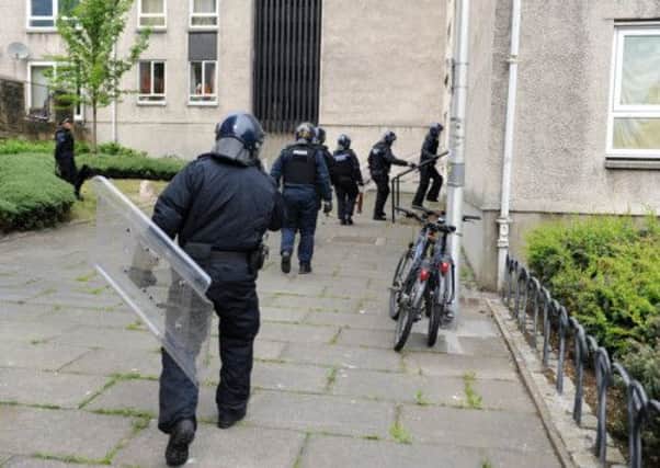 Armed Police attended an incident in Dumbiedykes road, Edinburgh today. Picture: Ian Rutherford