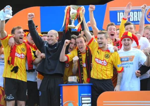 Partick Thistle celebrate becoming the final Irn-Bru First Division champions. Picture: Robert Perry