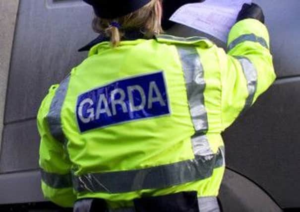 Garda officers arrested the two women after the topless brawl. Picture: Reuters