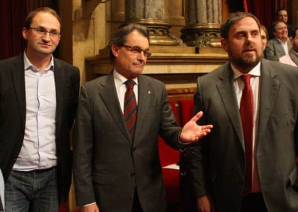 Artur Mas, left, needs Oriol Junqueras, right - and the ERC - to keep his coalition together. Picture: Getty