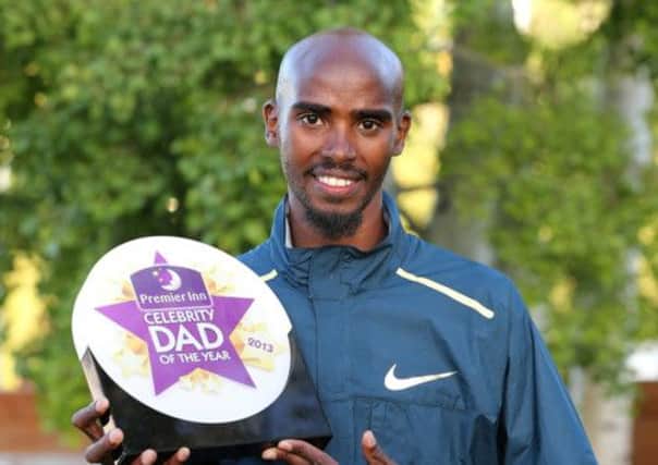 Mo Farah with his Premier Inn Celebrity Dad of the Year award. Picture: PA