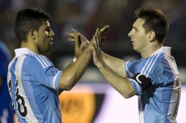 Lionel Messi, right, celebrates with Sergio Aguero after scoring against Guatemala. Picture: AP