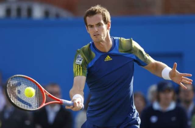 Andy Murray swept aside Marin Cilic to claim his third Queen's title after rain delayed the final match. Picture: PA
