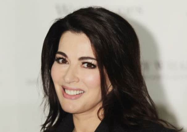 Nigella Lawson: Photos were result of 'playful tiff', claimed husband. Picture: PA