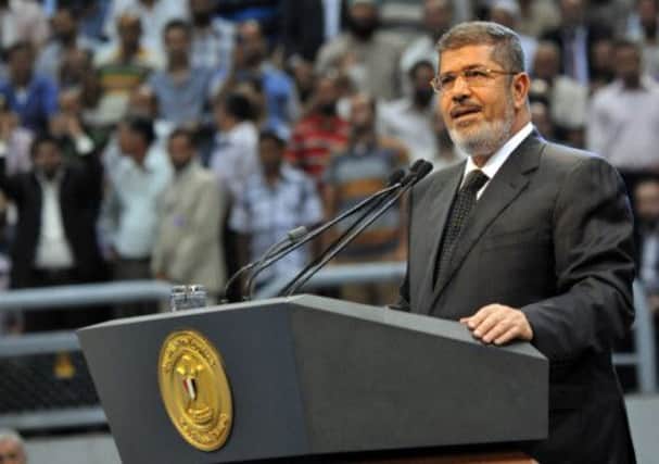 Mohamed Morsi swore in 17 new governors yesterday. Picture: AP