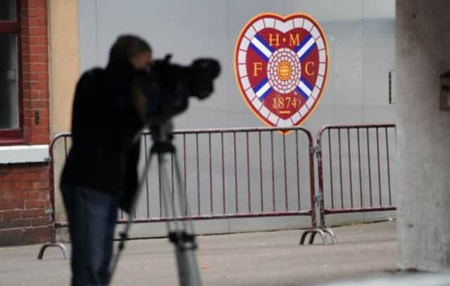 The media gathers outside Tynecastle yesterday as the news broke that the club had signalled its intention to appoint administrators. Picture: Ian Rutherford