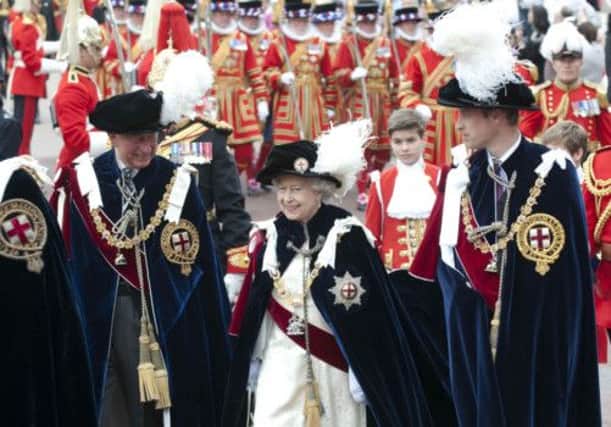 The Queen flanked by Prince Charles and Prince William. Picture: Reuters