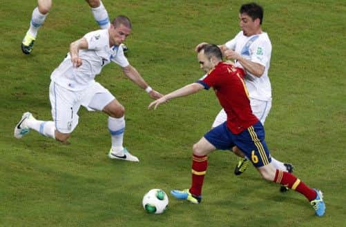 The imperious Andres Iniesta was Spain's best player as the World champions eased past the challenge of a fading Uruguay. Picture: AP