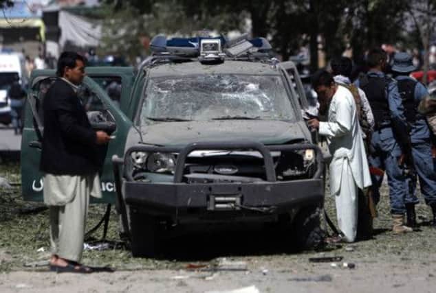 Afghan security forces at the site of an explosion in Kabul yesterday. Picture: Reuters