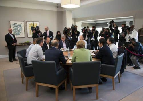 G8 leaders attend a plenary session today. Picture: AP
