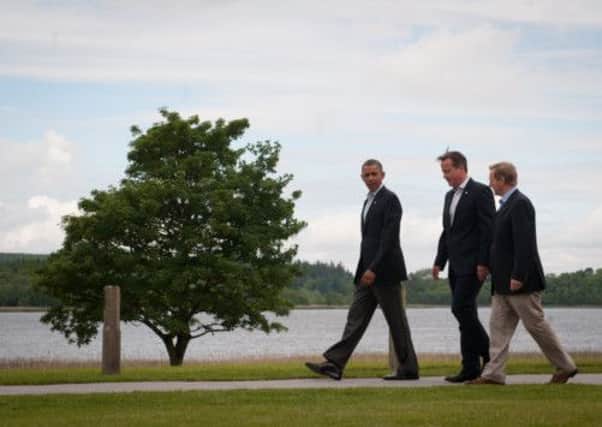 Barack Obama, David Cameron and Enda Kenny walk to lunch at the G8 summit. Picture: PA