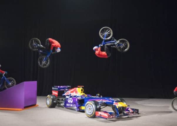 Danny MacAskill jumps over a Red Bull F1 car during the Imaginate filming in Glasgow