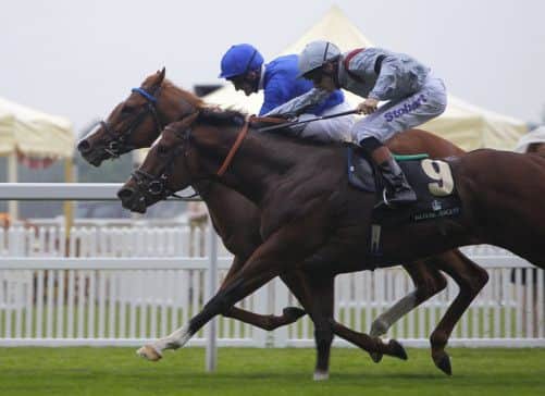 Kevin Manning and Dawn Approach, far side, battle Toronado, under Richard Hughes, in the St Jamess Palace Stakes. Picture: AP