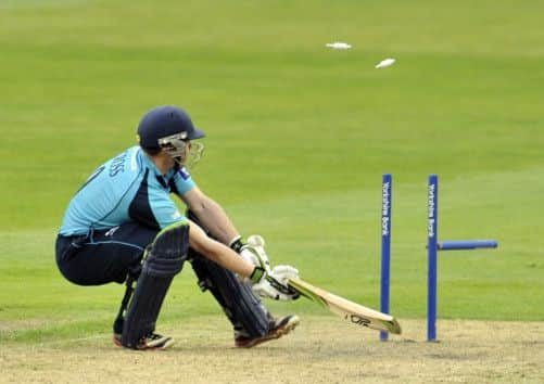 Matthew Cross loses his middle stump to Kabir Ali for six at Old Trafford yesterday. Picture: Getty