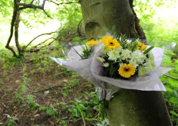 A floral tribute left on Corstorphine Hill, Edinburgh, where the body of a woman was found. Picture: Jane Barlow