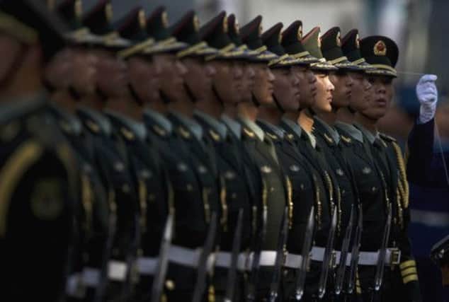 Chinese troops get in line in Beijing. Picture: AP
