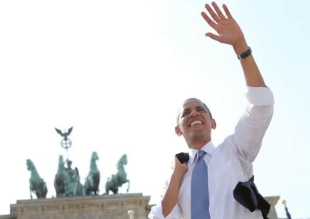 President Obama waves to spectators before he delivers a speech in front of the Brandenburg Gate. Picture: AP