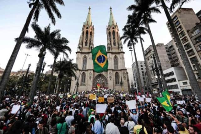Demonstrators in Praca da Se in Sao Paulo after bus and subway fares were increased from three to 3.2 reais (94p). Picture: Getty