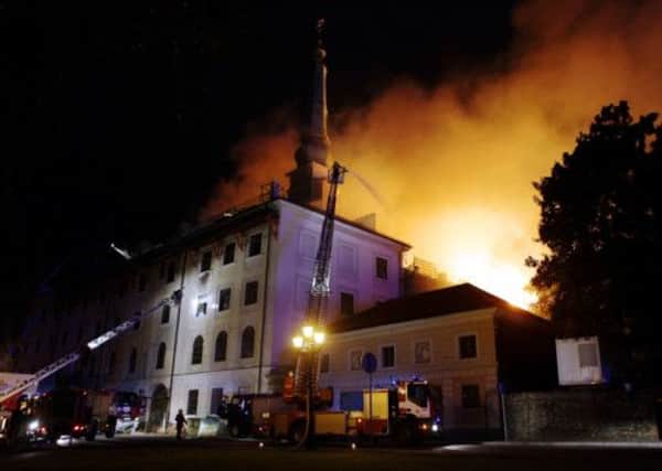 Firefighters battle the blaze at the historic castle in the Latvian capital. Picture: AFP