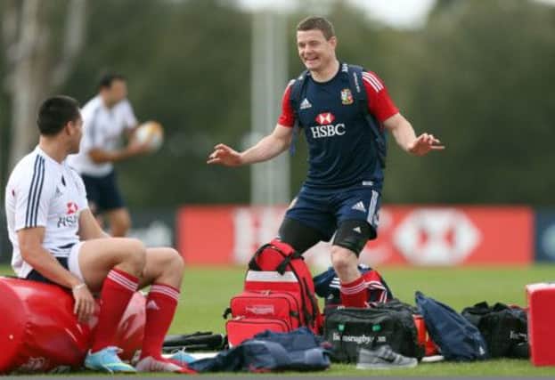 Lions Brian O'Driscoll chats with Sean Maitland during the training session. Picture: PA