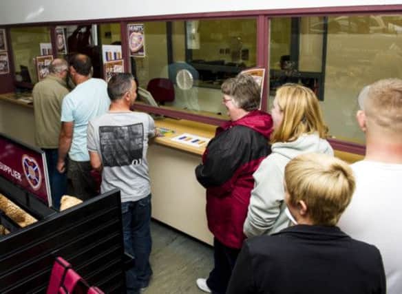 Hearts fans queue up to buy season tickets and merchandise from the club store. Picture: SNS