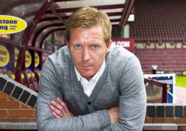 Hearts manager Gary Locke cut a concerned figure at Tynecastle yesterday at the end of a terrible week for his club. Picture: SNS