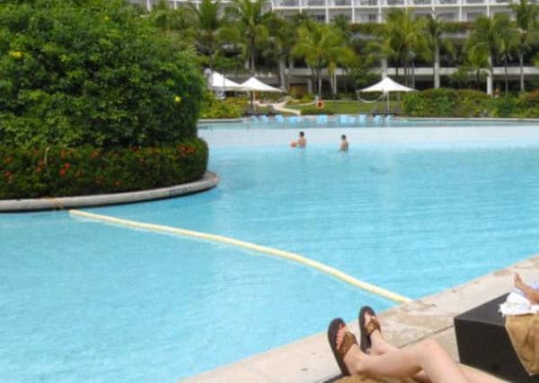 Drinks by the pool eat into the Scottish holiday budget. Picture: Getty