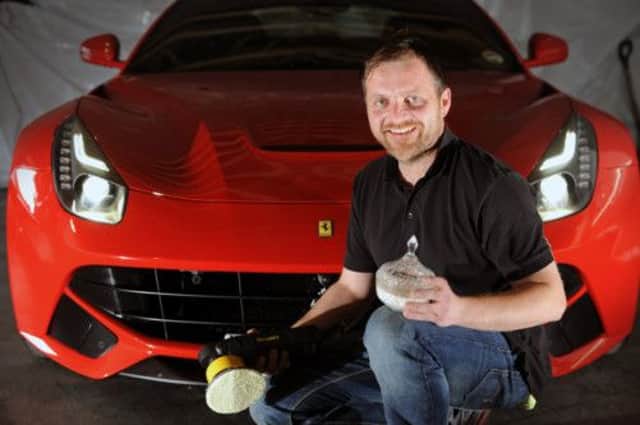 Paul Wilkins holds a jar of Carnauba wax from Brazil which he uses to spruce up some of the worlds most expensive cars. Picture: Lesley Martin