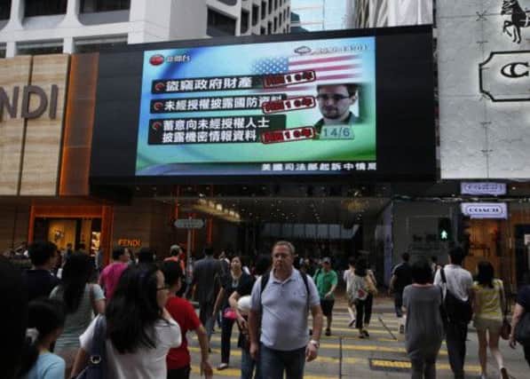 A screen shows a news report of former CIA employee Edward Snowden in Hong Kong. Picture: AP