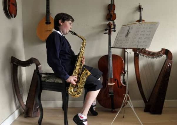 Saxophonist Sophie Hunter, ten, from Dalgety Bay in Fife. Photograph: Phil Wilkinson