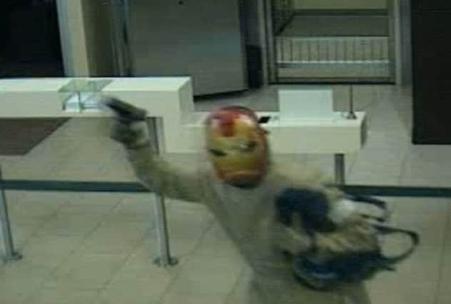 CTTV images showed the man in the mask waving a gun. Picture: Complimentary