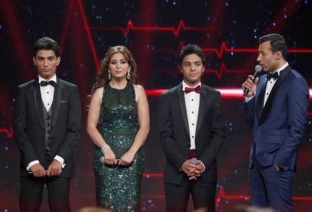 The three finalists Palestinian Mohammed Assaf, Syrian Farah Yousef and Egyptian Ahmed Jamal wait for the results. Picture: Reuters