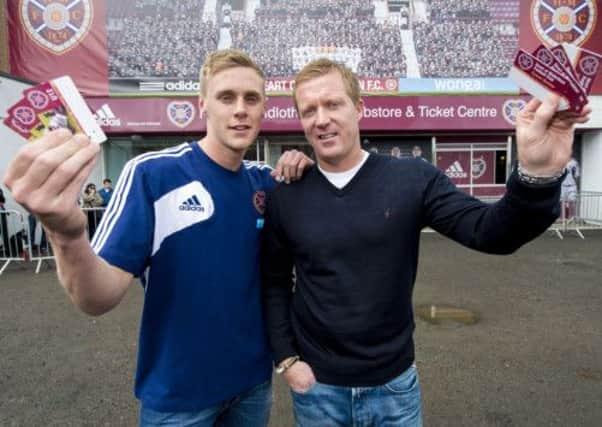 Hearts manager Gary Locke and player Kevin McHattie stop by the club shop to help sell season tickets. Picture: SNS