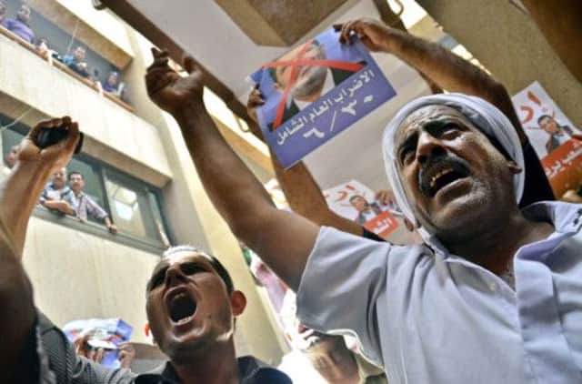 Protesters chant slogans against president Morsi. Picture: AP