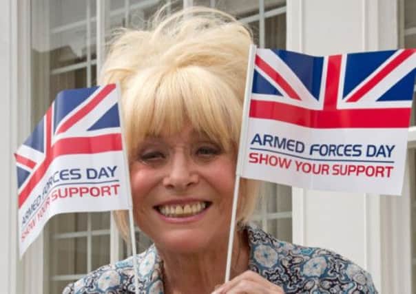 Barbara Windsor flies the flag. Picture: PA
