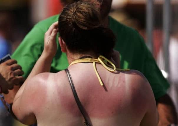 Many Scots are risking skin cancer by trying to get a deeper tan. Picture: PA