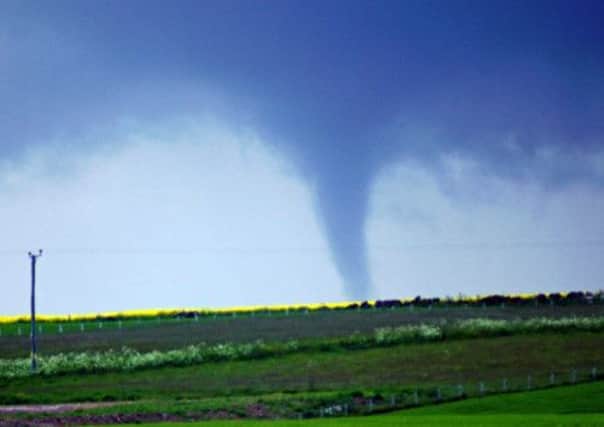 This picture, taken by David Gault, shows a tornado sweeping across farmland near Stonehaven in Aberdeenshire. Picture: Hemedia/David Gault