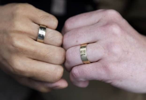 The Scottish Government has pledged that if the bill is passed, no church or religious celebrant will be compelled to conduct same-sex marriages. Picture: AP