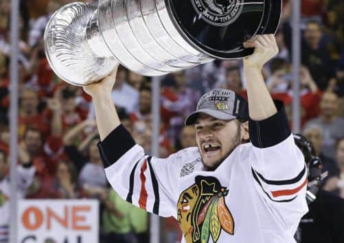 Chicago Blackhawks winger Daniel Carcillo hoists the Stanley Cup. Picture: AP