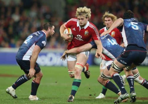 Richie Gray makes a break through the Melbourne Rebels defence. Picture: Getty