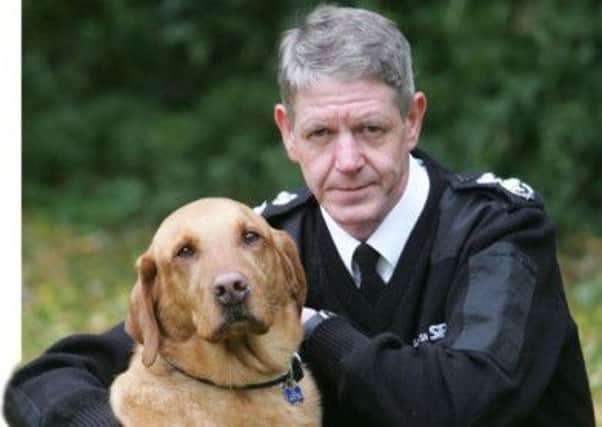 Scottish SPCA Chief Superintendent Mike Flynn with Monty the Golden Labrador. Picture: Contributed