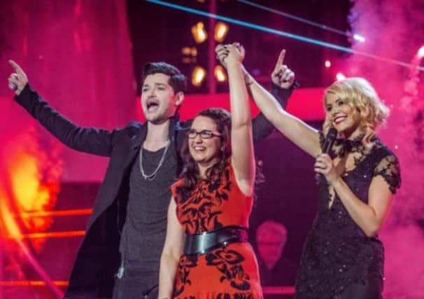 Andrea Beglewith with Danny O'Donoghue and Holly Willoughby, after she was crowned the winner of the this year's BBC show. Picture: PA