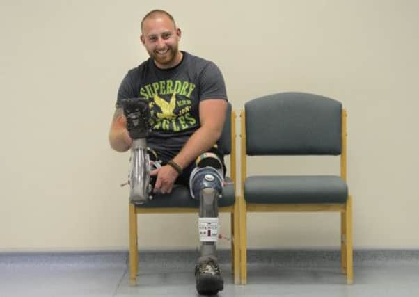 Steven Richardson, who was injured in Afghanistan in 2010 and lost his leg and some fingers after standing on an explosive, tries his new prosethesis. Picture: Neil Hanna