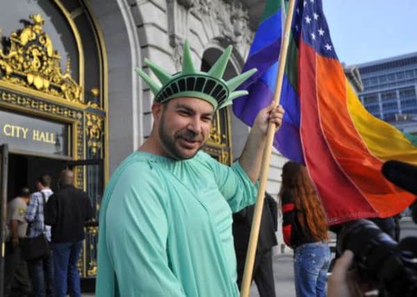 A man dressed as the Statue of Liberty celebrates the Supreme Court decision in San Francisco. Picture: Getty
