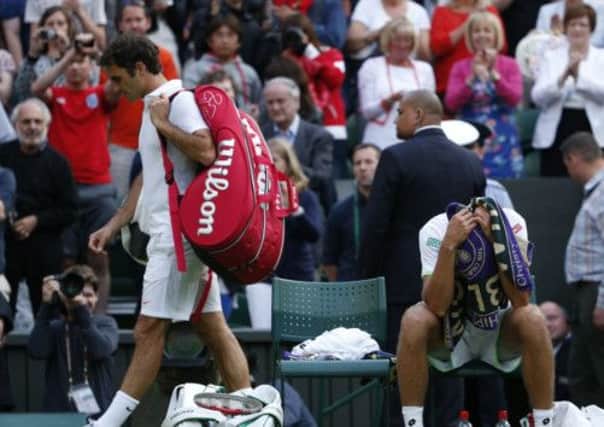 Roger Federer crashed out at SW19, leaving the way clear for Andy Murray. Picture: PA
