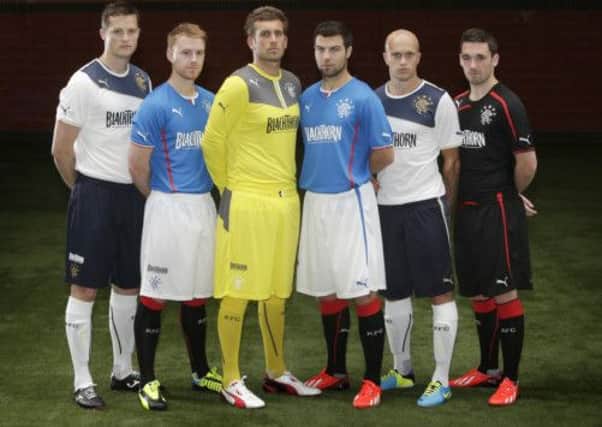 Rangers players model the club's new kits. Picture: PA