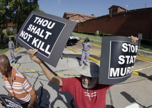 Protesters outside the Texas death chamber in Huntsville, TX. Picture: AP